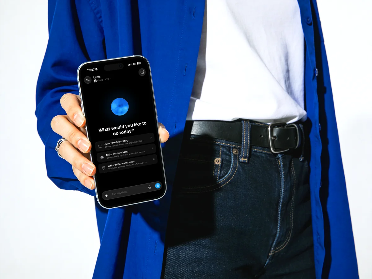 Lapis promotional image: a person in a blue jacket holding an iPhone showing the app’s home screen.